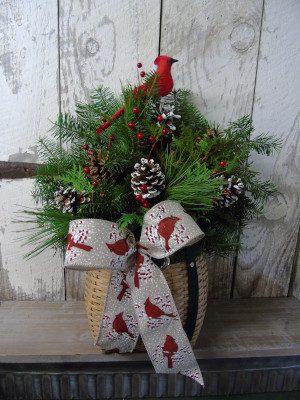 A basket of leaves with a red bird