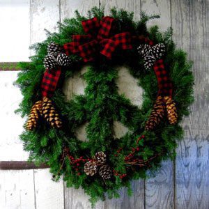 A peace sign wreath with pine cones
