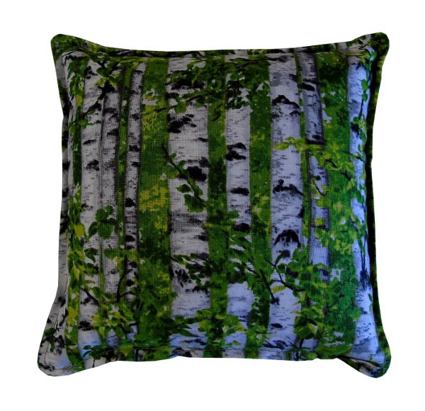 A pillow with a birch tree