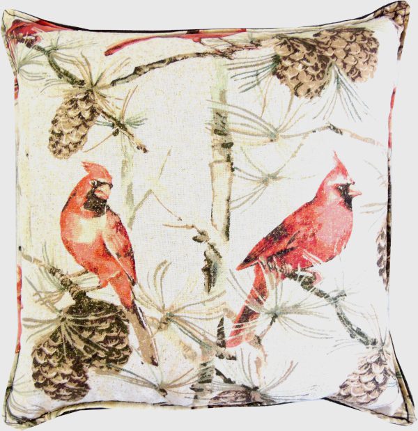 Cardinal birds on a beige pillow