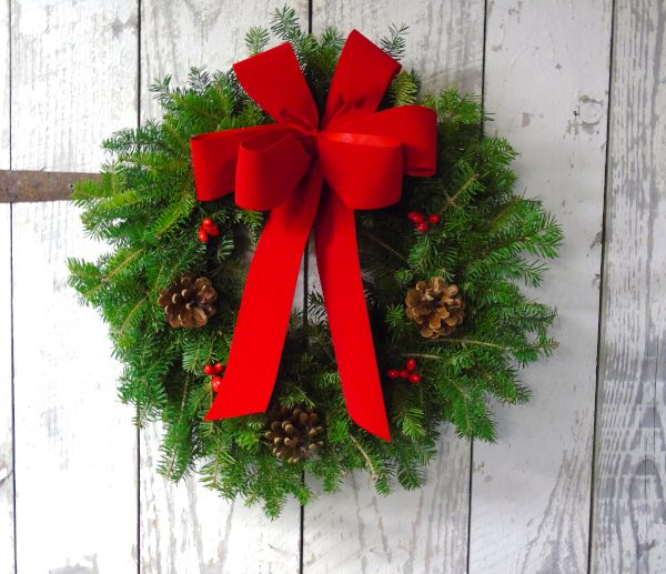 A wreath with a red ribbon