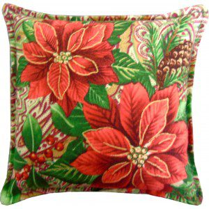 A pillow with poinsettias and pine cones design