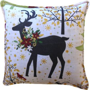 A pillow with a deer and flowers design
