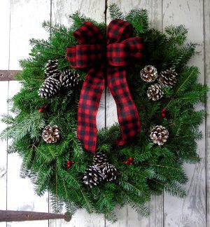 A holiday wreath with a ribbon