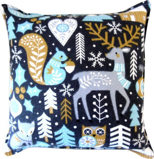 Teal-colored pillow with whimsical woodland animals (1)