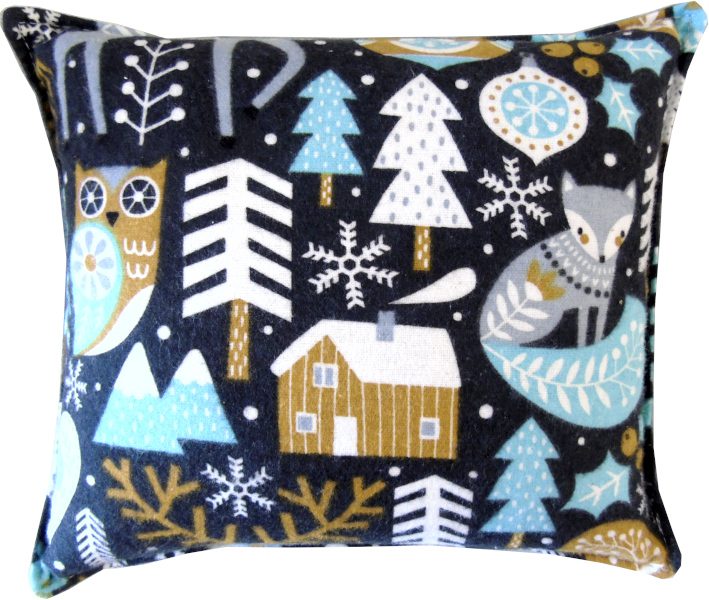 Teal-colored pillow with whimsical woodland animals